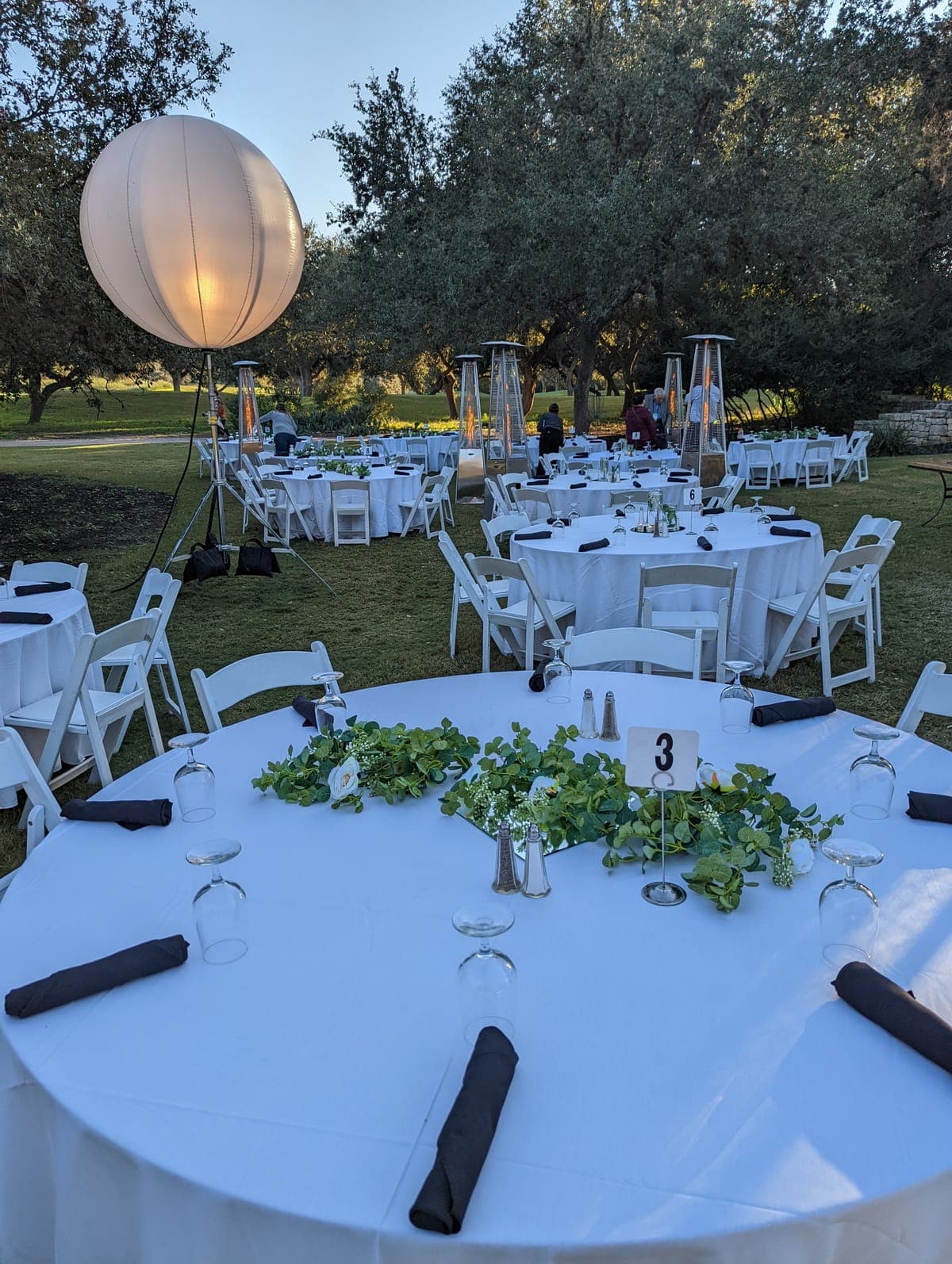 Prom venue decorated with uplighting and custom backdrop in Chesapeake